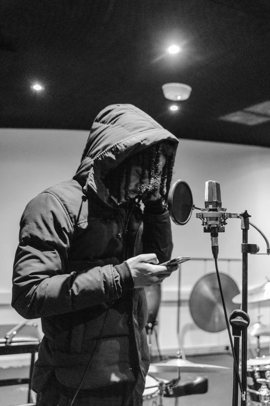 Hooded session at the mic, B&W